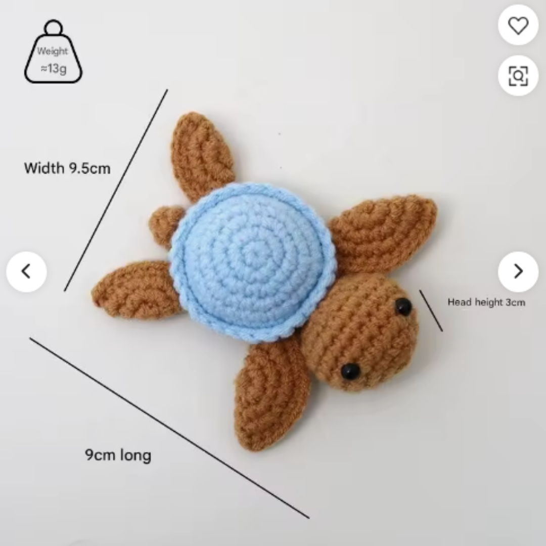 Crocheted turtle toy with measurements on a white background